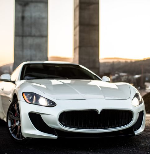 white-coupe-sport-car-standing-road-front-view white-coupe-sport-car-standing-road-front-view